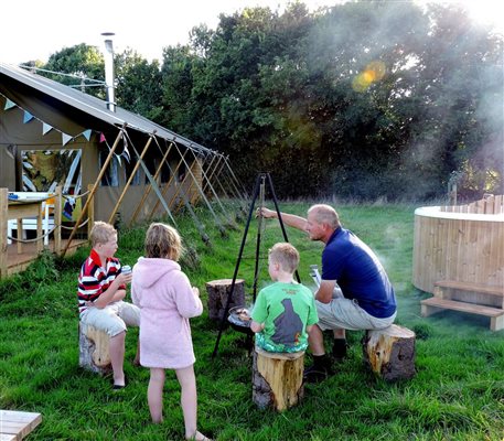 family barbecue glamping tent
